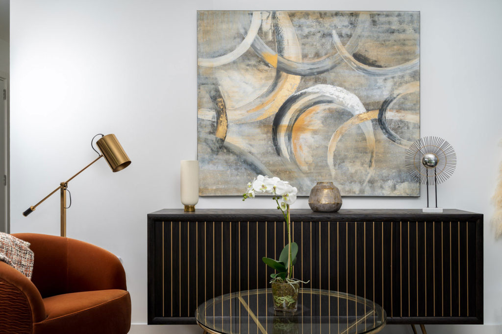 Orange velvet armchair and midcentury sideboard