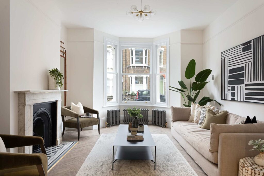 living room with large window and fireplace